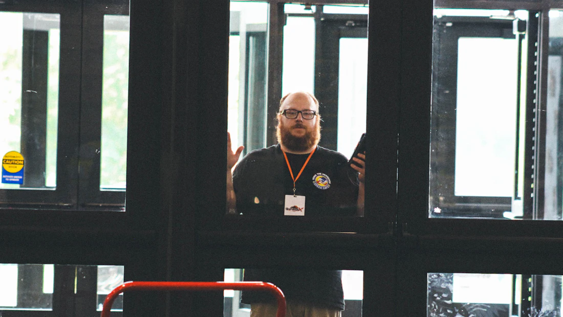 Uniformed security officer monitoring a building entrance